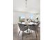 Inviting dining area with a round table, stylish chairs, and a view of the backyard at 1009 Marsh Harrier Dr # Cc3-2-2P, Ravenel, SC 29470