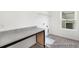 Well-lit laundry room with ample counter space and storage, perfect for organization at 1009 Marsh Harrier Dr # Cc3-2-2P, Ravenel, SC 29470