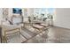 Bright living room featuring modern decor, a comfortable sofa, and large windows at 1009 Marsh Harrier Dr # Cc3-2-2P, Ravenel, SC 29470