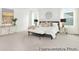Spacious main bedroom with large windows, plush carpeting, and stylish decor; a relaxing retreat at 1009 Marsh Harrier Dr # Cc3-2-2P, Ravenel, SC 29470