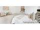Bright main bedroom features stylish decor, comfortable seating, and plenty of natural light at 1009 Marsh Harrier Dr # Cc3-2-2P, Ravenel, SC 29470