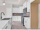 Bright kitchen with stainless steel appliances and white cabinetry at 1060 Marsh Harrier Dr # Cc3-15-8P, Ravenel, SC 29470