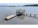 Aerial shot of a pier and gazebo on the water, offering panoramic views of the surrounding landscape at 1085 Harts Bluff Rd, Wadmalaw Island, SC 29487