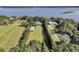 Aerial view of an estate featuring well-manicured grounds, a home and long private drive at 1085 Harts Bluff Rd, Wadmalaw Island, SC 29487