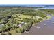 An amazing aerial view of a waterfront estate, featuring lush greenery, multiple docks, and water access at 1085 Harts Bluff Rd, Wadmalaw Island, SC 29487