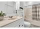 Bright bathroom with a sink, toilet, tub, and shower featuring a shower curtain and a shelf with greenery at 1085 Harts Bluff Rd, Wadmalaw Island, SC 29487