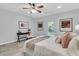 Bright bedroom featuring a ceiling fan, ample lighting, and a workspace at 1085 Harts Bluff Rd, Wadmalaw Island, SC 29487
