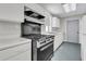 Simple kitchen with a modern gas range and lots of storage space at 1085 Harts Bluff Rd, Wadmalaw Island, SC 29487