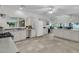 Large kitchen with white cabinetry, a central island, and an open layout to the living area at 1085 Harts Bluff Rd, Wadmalaw Island, SC 29487