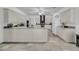 Spacious, bright kitchen with white cabinets, an island, and modern appliances at 1085 Harts Bluff Rd, Wadmalaw Island, SC 29487