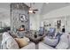 Inviting living room centered around a stone fireplace, flanked by comfortable seating areas at 1085 Harts Bluff Rd, Wadmalaw Island, SC 29487