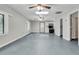 A spacious living room with large windows and neutral paint at 1085 Harts Bluff Rd, Wadmalaw Island, SC 29487