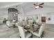 Open-concept living space with a stone fireplace, ideal for Gathering gatherings and dinner parties at 1085 Harts Bluff Rd, Wadmalaw Island, SC 29487
