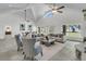 Bright living room with high ceilings, large windows overlooking the lawn and an outdoor view at 1085 Harts Bluff Rd, Wadmalaw Island, SC 29487