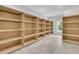 Ample shelving for storage, with natural light from a window at 1085 Harts Bluff Rd, Wadmalaw Island, SC 29487