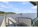 Picturesque view of a gazebo and pier on the water, taken from a nearby dock at 1085 Harts Bluff Rd, Wadmalaw Island, SC 29487
