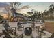 Expansive backyard with a sparkling pool, cozy fire pit area, and ample seating for entertaining guests outdoors at 1098 Reserve Ln, Awendaw, SC 29429