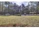 Expansive backyard with pool, outdoor kitchen, and playhouse, perfect for Gathering fun at 1098 Reserve Ln, Awendaw, SC 29429