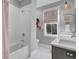 Bathroom featuring a shower/tub combination, modern sink, and window at 1098 Reserve Ln, Awendaw, SC 29429