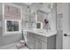 Well-lit bathroom featuring a double sink vanity with modern lighting and fixtures at 1098 Reserve Ln, Awendaw, SC 29429