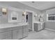 Bathroom with dual sink vanities and a large walk-in closet at 1098 Reserve Ln, Awendaw, SC 29429