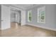 Bright bedroom with large windows and doorway leading to another room at 1098 Reserve Ln, Awendaw, SC 29429