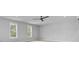 This bedroom has a ceiling fan and great natural light from two windows at 1098 Reserve Ln, Awendaw, SC 29429