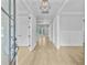 Inviting entryway with hardwood floors, high ceilings, and a view of the main living space at 1098 Reserve Ln, Awendaw, SC 29429