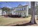 Charming two-story home with a covered front porch, well-maintained lawn, and mature trees at 1098 Reserve Ln, Awendaw, SC 29429