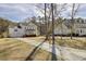 Elegant two-story home with a welcoming front porch, lush landscaping, and a long driveway at 1098 Reserve Ln, Awendaw, SC 29429