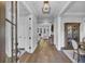 Elegant foyer with hardwood floors, white trim, and sophisticated decor, creating a welcoming entrance at 1098 Reserve Ln, Awendaw, SC 29429