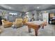 Entertaining game room boasts a pool table, comfortable seating, and a large flatscreen TV at 1098 Reserve Ln, Awendaw, SC 29429