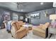 Cozy game room features comfortable seating, flatscreen TV, and a stylish coffee table at 1098 Reserve Ln, Awendaw, SC 29429