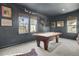 Spacious game room features a pool table, neutral carpet, grey walls, and a natural light at 1098 Reserve Ln, Awendaw, SC 29429
