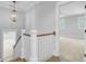 The hallway features white trim, wood floors, and a modern light fixture at 1098 Reserve Ln, Awendaw, SC 29429