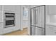 This kitchen features stainless steel appliances and white cabinets at 1098 Reserve Ln, Awendaw, SC 29429