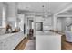 Bright, open-concept kitchen with stainless steel appliances and adjacent dining area at 1098 Reserve Ln, Awendaw, SC 29429