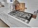 White countertops, stainless steel range, and subway tile create a timeless kitchen at 1098 Reserve Ln, Awendaw, SC 29429