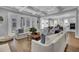 Spacious open-concept living room flowing into the kitchen with stylish furniture and ample natural light at 1098 Reserve Ln, Awendaw, SC 29429