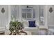Bright living room featuring white sofa, natural light, and view of outdoor space at 1098 Reserve Ln, Awendaw, SC 29429
