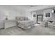 Charming main bedroom boasts neutral colors, bright windows, and comfortable seating at 1098 Reserve Ln, Awendaw, SC 29429
