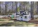 Charming backyard playhouse with swing and slide, perfect for outdoor fun at 1098 Reserve Ln, Awendaw, SC 29429