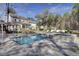 Stunning backyard pool and spa with travertine tile surround and outdoor living space at 1098 Reserve Ln, Awendaw, SC 29429
