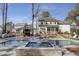 Backyard pool and outdoor fireplace with comfortable seating and mature trees at 1098 Reserve Ln, Awendaw, SC 29429