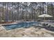 Inviting pool with integrated lounge area and sun umbrella at 1098 Reserve Ln, Awendaw, SC 29429