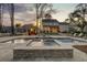 Luxurious backyard with a large swimming pool, spa, outdoor lounge area, and a well-manicured lawn at 1098 Reserve Ln, Awendaw, SC 29429