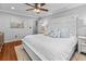 Spacious bedroom boasts a king-size bed and a light color scheme with views of the backyard at 1129 Shady Grove Ln, Mount Pleasant, SC 29464