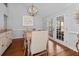 Cozy dining room showcasing hardwood floors, modern lighting, and access to the backyard at 1129 Shady Grove Ln, Mount Pleasant, SC 29464