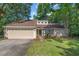 Charming single-story home featuring a two-car garage and a well-manicured lawn at 1129 Shady Grove Ln, Mount Pleasant, SC 29464