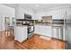 Modern kitchen equipped with stainless steel appliances, granite countertops, and white cabinetry at 1129 Shady Grove Ln, Mount Pleasant, SC 29464